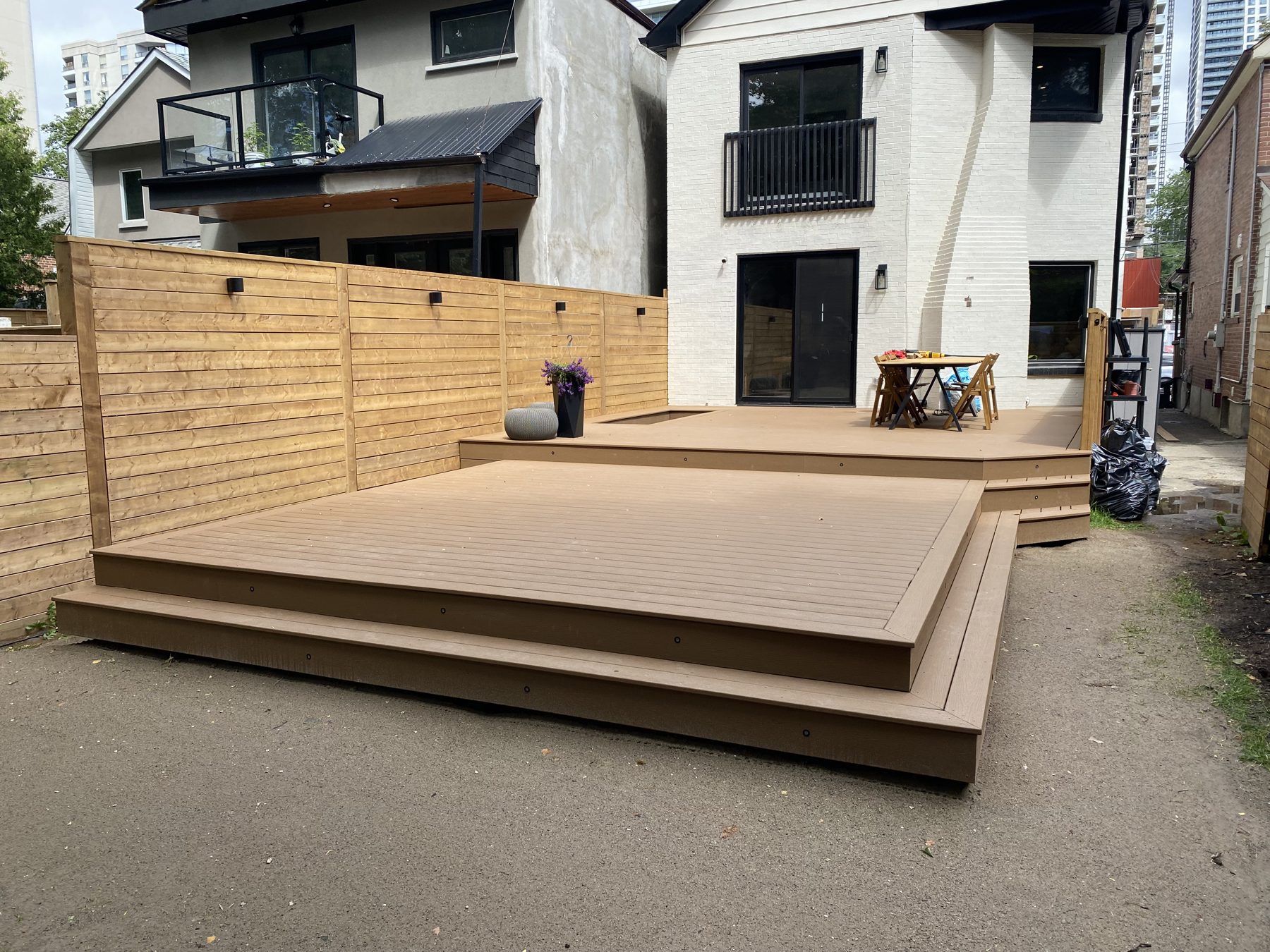 Two-level residential deck with stairs in a Little Portugal, Toronto backyard, built by Kopman Build in 2024